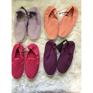 4 Pairs of little girls slip on sneakers. Size Medium. New With Tags